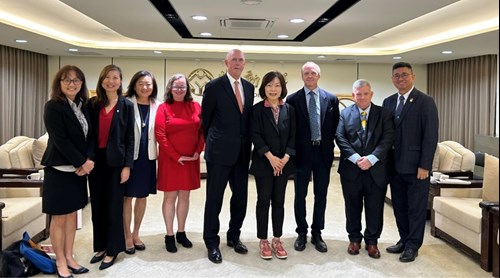 Figure 11: Minister of Labor Pei-shan Ho, along with colleagues, poses for a photo with Steve Sleigh and 6 members of the U.S. labor union leaders' delegation.